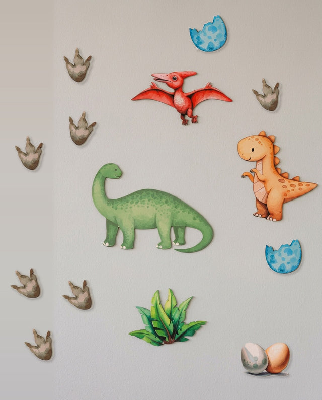 Dinosaur wooden wall art set arranged as on the move — The full prehistoric scene, footprints trailing across the wall.