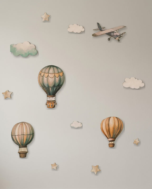 Hot Air Balloon wooden wall art set arranged as take-off — Balloons rising past clouds and stars, the airplane cutting through.