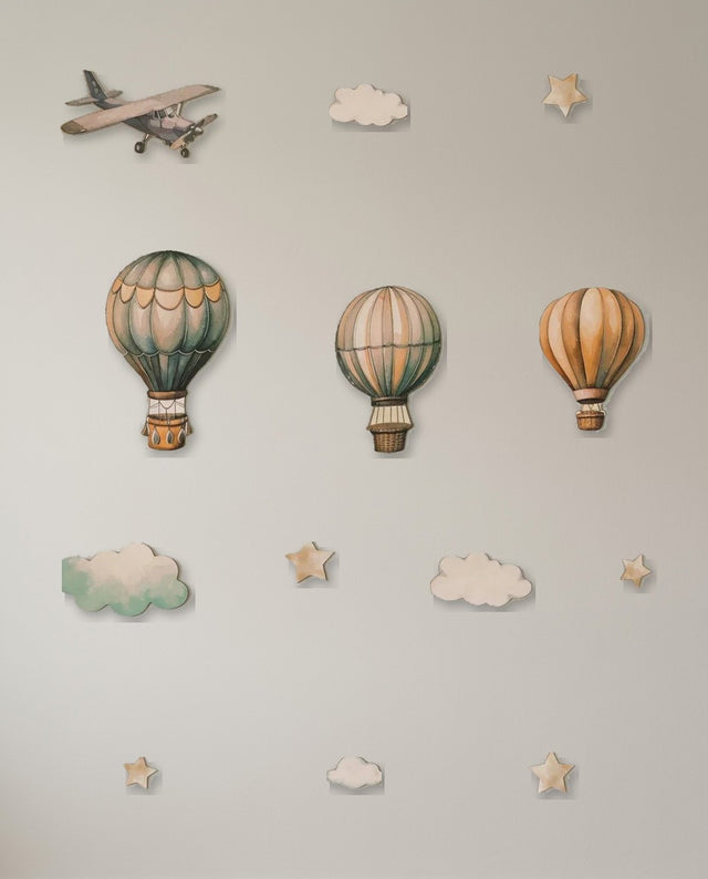 Hot Air Balloon wooden wall art set arranged as across the sky — The scene spread wide along a shelf, like a horizon.