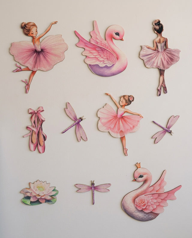 Ballerina wooden wall art set arranged as in the wings — The dancers lined along a shelf, as if waiting to go on.