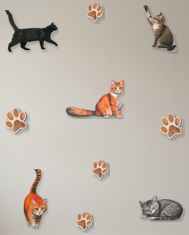 Cats wooden wall art set arranged as the chase — Cats trailing paw prints across the wall, as if mid-chase.