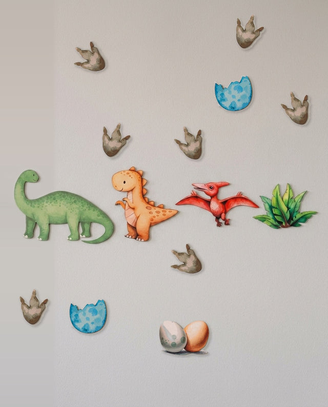 Dinosaur wooden wall art set arranged as along the ridge — The dinosaurs lined up on a shelf, like a rocky outcrop.