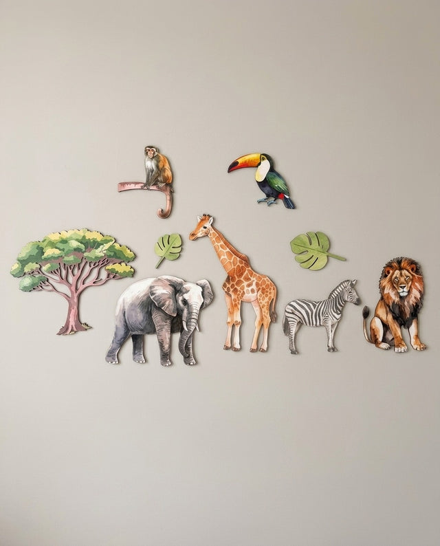 Safari wooden wall art set arranged as along the watering hole — The animals lined up on a shelf, as if queuing for a drink.
